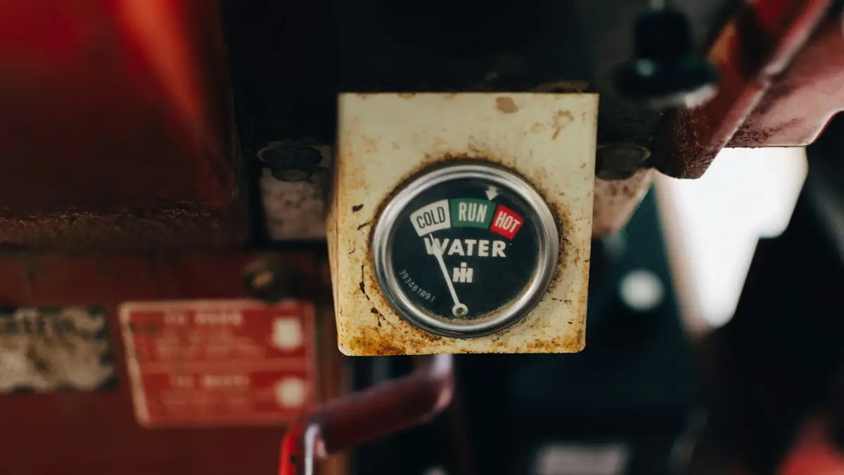 A water gauge in a worn metal housing - Leak Detection in Mount Prospect